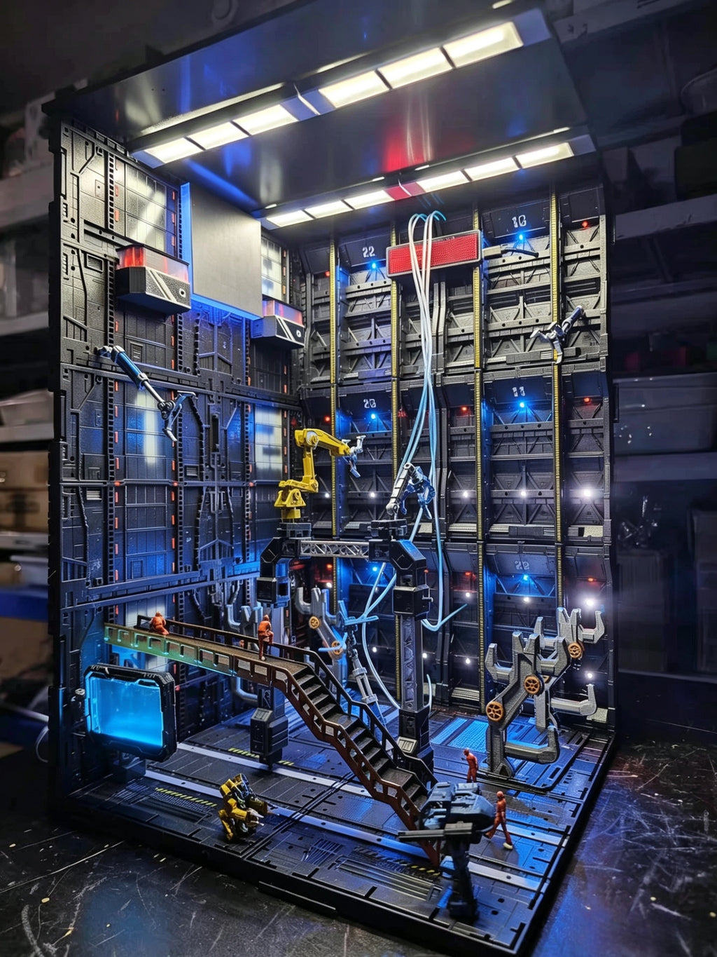 High-end action figure diorama depicting a futuristic hangar background.